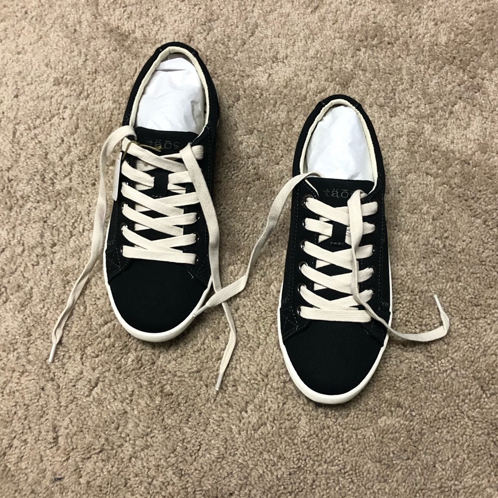 Brand new unworn Taos sneakers in black (6.5)